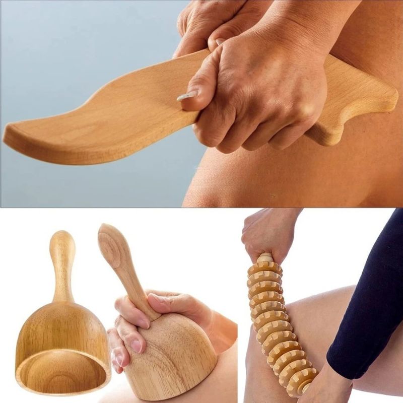 Outil latéral, ventouse et rouleau à roues en bois utilisés sur les jambes lors d'un massage manuel